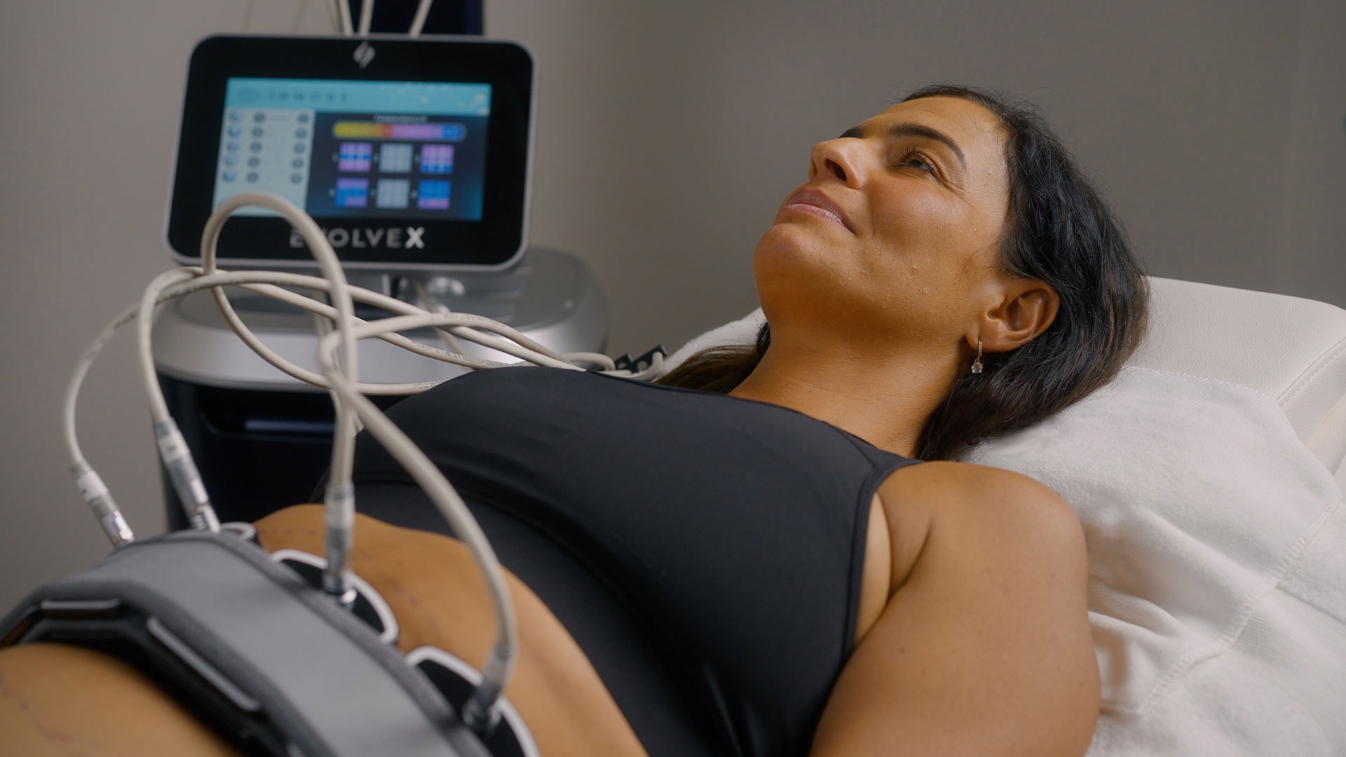 EvolveX treatment on a woman's abs