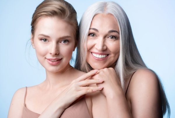 Young woman and more mature woman smiling